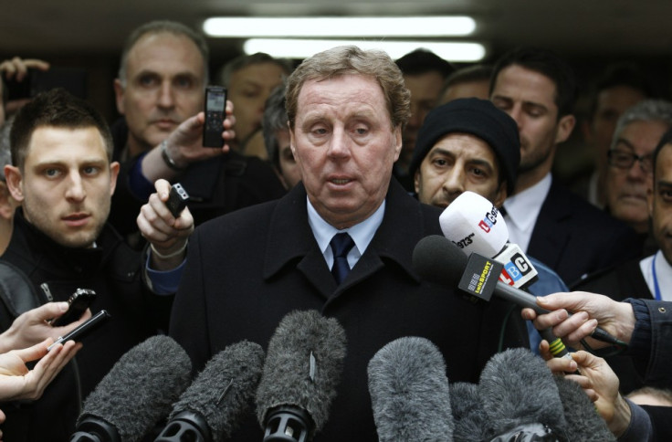Tottenham Hotspur soccer manager Harry Redknapp speaks to members of the media as he leaves Southwark Crown Court in London