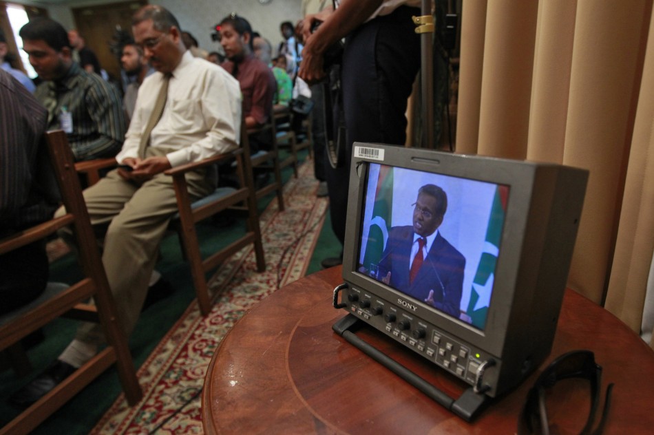 Maldives newly appointed President Manik is seen on a monitor as he speaks during a news conference at the presidential office in Male