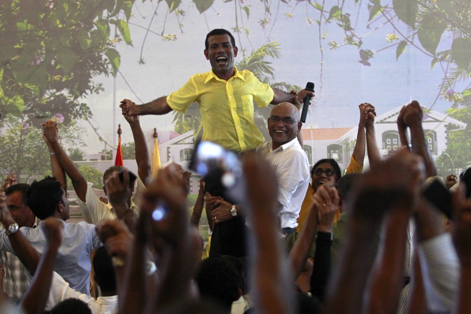 Ousted Maldivian president Mohamed Nasheed is carried by his supporters in Male