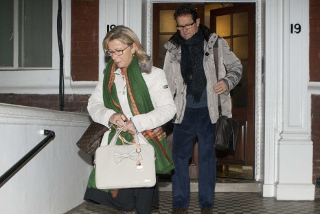 Former England football manager Fabio Capello leaves his Belgravia home with his wife Laura, the morning after resigning his post