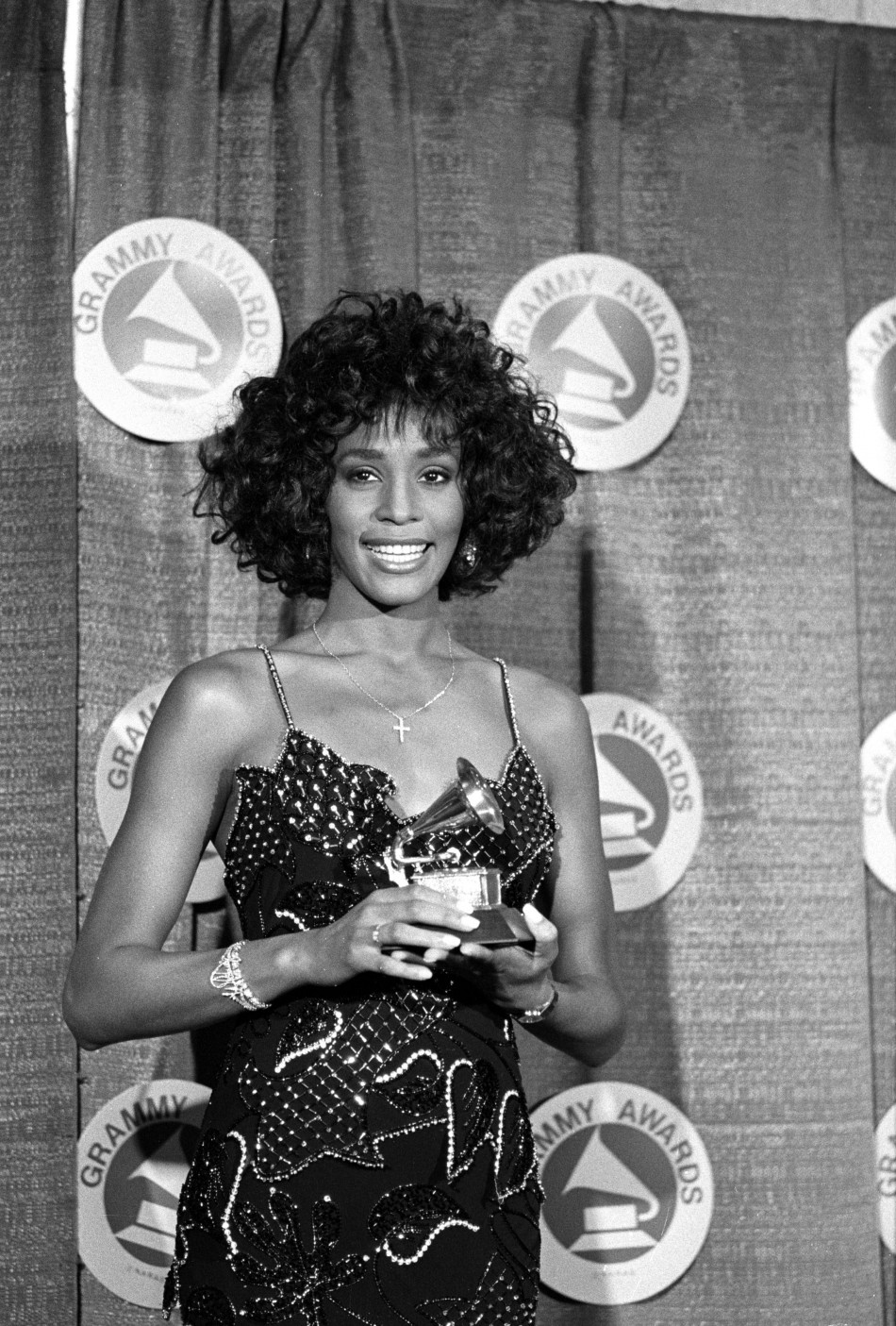 Houston poses with her Grammy after she was named Best Pop Vocal Performer-Female at the 30th annual Grammy Awards at New Yorks Radio City Music Hall