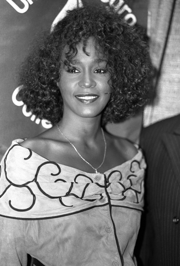 Whitney Houston smiles at a news conference in New York on July 11, 1988