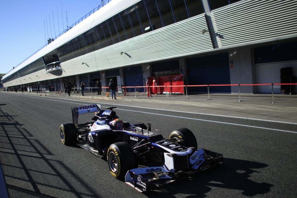 Williams Formula One driver Maldonado of Venezuela drives the FW34 in the pit-lane in Jerez