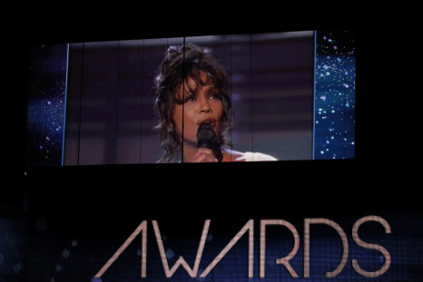 Singer Whitney Houston is shown on a video screen in a 1994 Grammy performance during the 54th annual Grammy Awards in Los Angeles