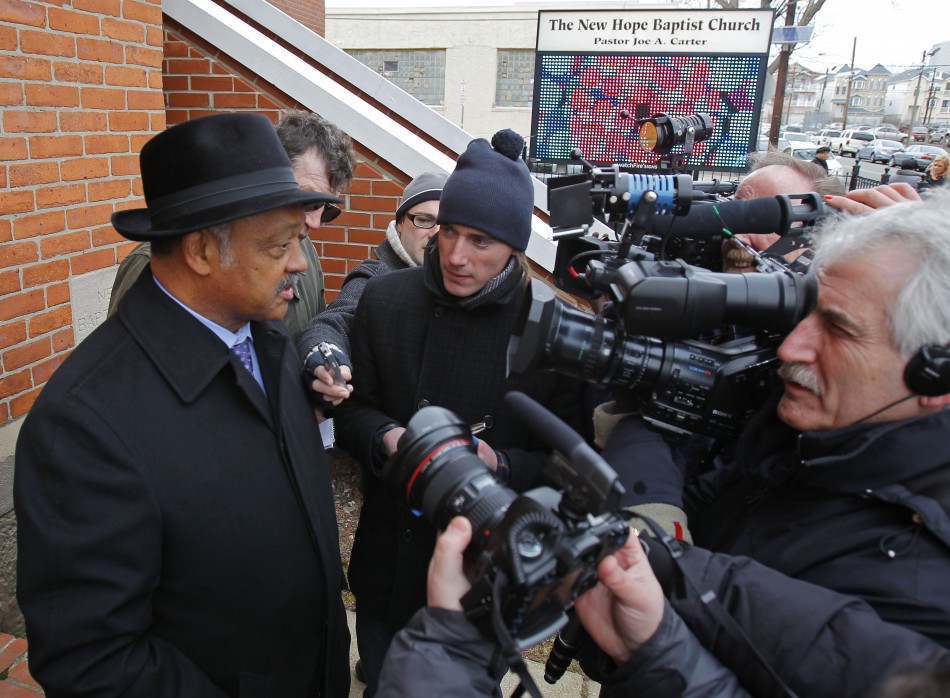 Civil rights leader Reverend Jesse Jackson speaks with the media outside The New Hope Baptist Church where Whitney Houston sang in the choir to mourn the death of the singer in Newark
