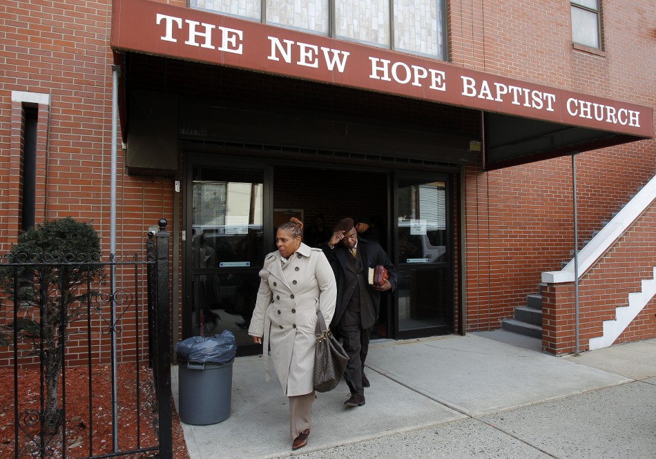 Parishioners of The New Hope Baptist Church where Whitney Houston sang in the choir leave after a morning service in Newark