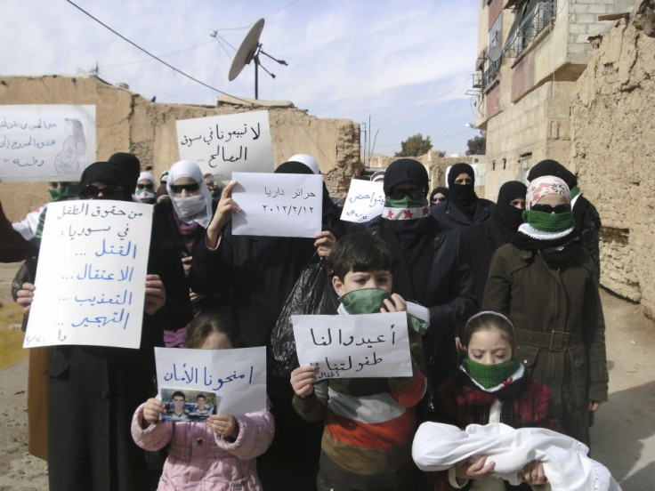 Demonstrators gather during a protest against Syria&#039;s President Bashar al-Assad in Daria, near Damascus