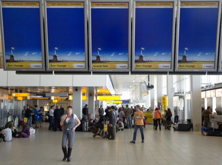 Travellers in departure lounge of Schiphol Airport in Amsterdam