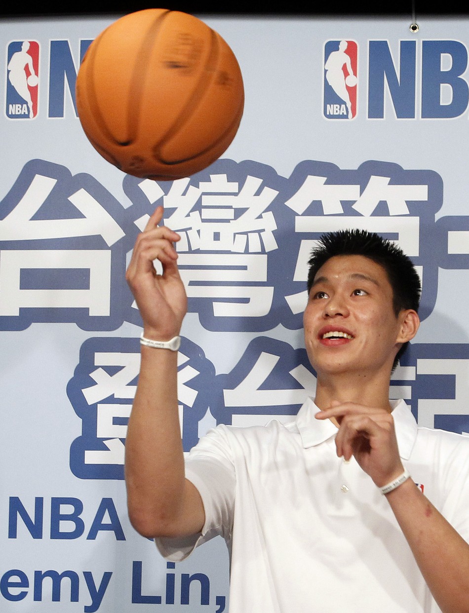 NBA player Lin of the Golden State Warriors poses for the media during a news conference in Taipei