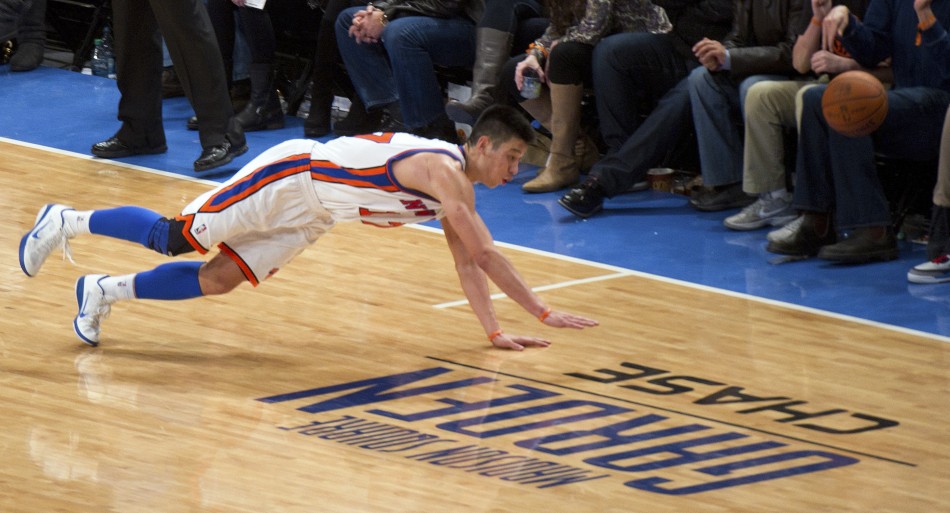 New York Knicks039 guard Lin dives for a ball out of bounds playing Los Angeles Lakers in NBA game in New York