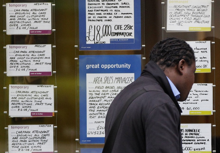 Man seen looking at job ads