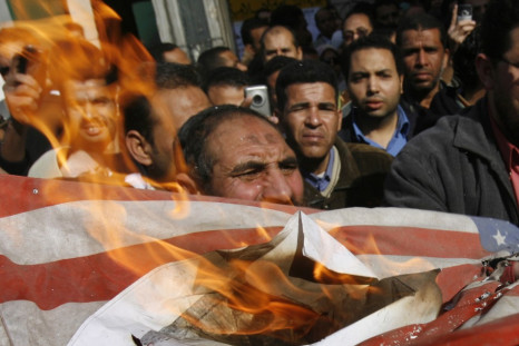 Egyptian demonstrators burn a U.S. flag