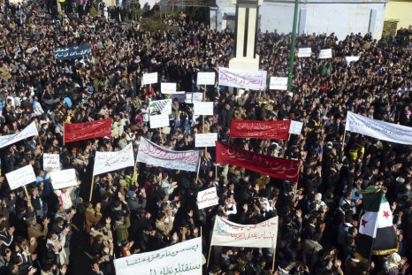 Demonstrators gather during a protest against Syria's President Bashar al-Assad, in Hula, near Homs