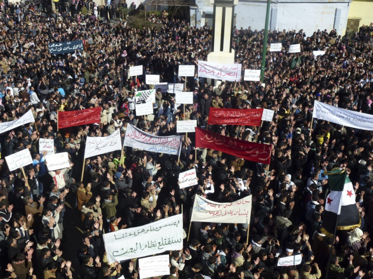 Demonstrators gather during a protest against Syria's President Bashar al-Assad, in Hula, near Homs