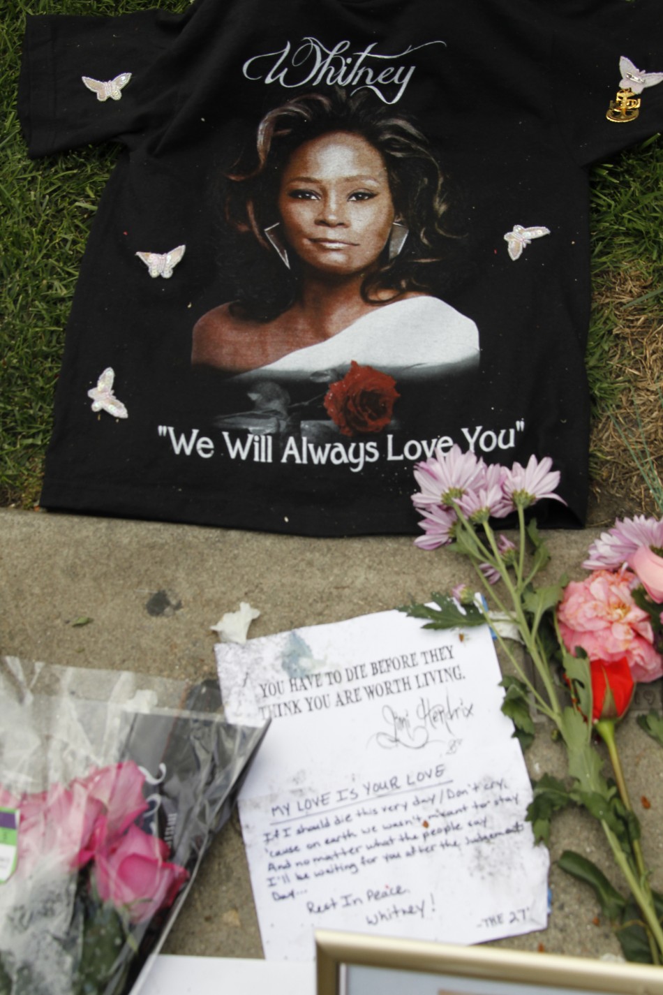 A T-shirt and a note left by a fan is pictured at a makeshift memorial to singer Whitney Houston at a corner of the Beverly Hilton Hotel in Beverly Hills
