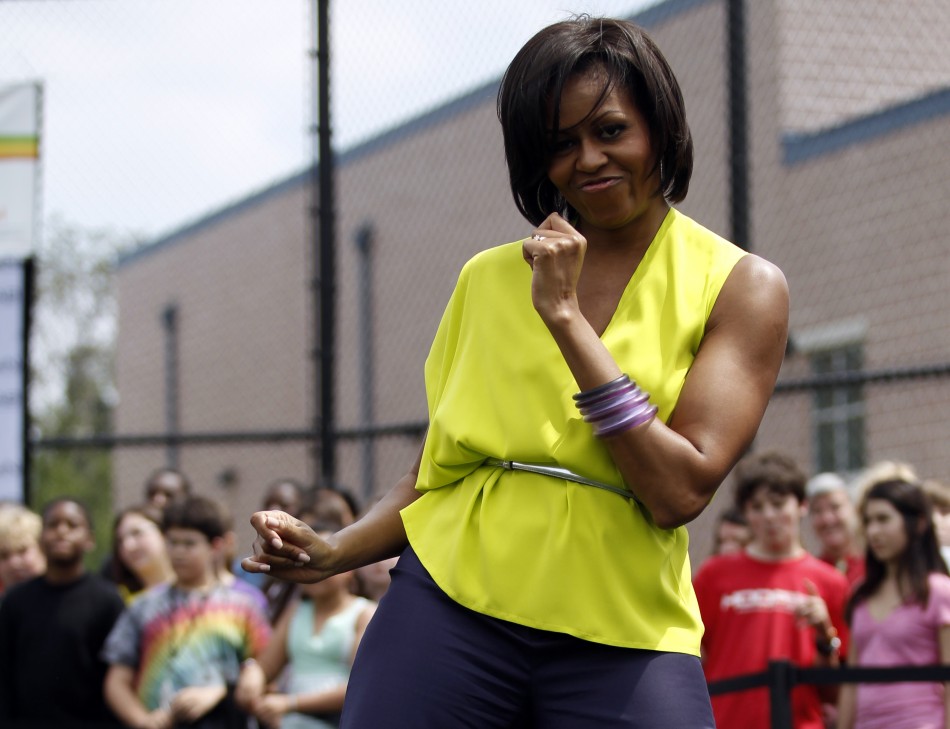 First lady Michelle Obama dances during a surprise visit to Alice Deal Middle School for a Let039s Move fitness event in Washington