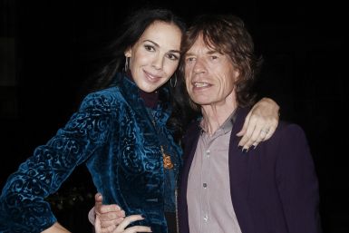Musician Mick Jagger and designer L'Wren Scott pose following her Fall/Winter 2012 collection during New York Fashion Week, February 16, 2012.