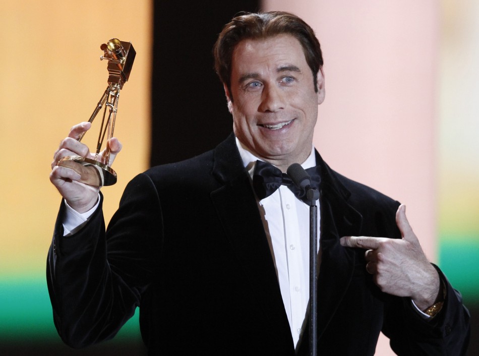 U.S.actor John Travolta receives the award for best international actor