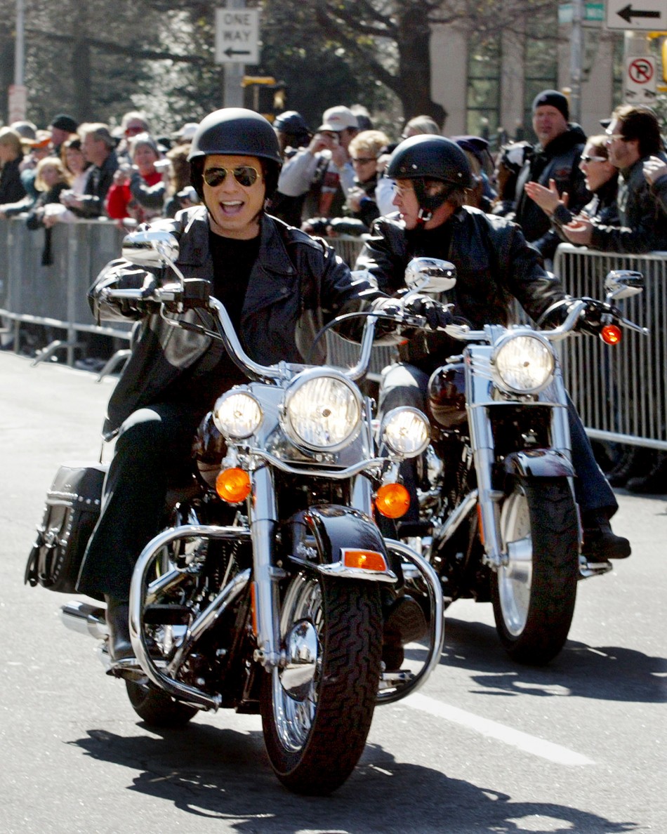 Actors John Travolta and Tim Allen R ride motorcycles