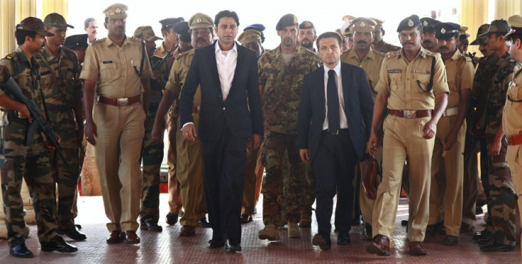 Enrica Lexie Salvatore Girone (centre, in military uniform) and Massimiliano Latore (behind him, with beard) arrive for police interrogation