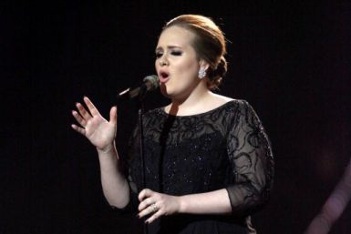 Adele performs on stage during the Brit Awards 2011