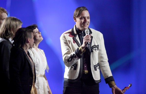 Arcade Fire collect a Brit award on stage during the Brit Awards 2011 at The O2 Arena in London, Tuesday, Feb. 15, 2011.