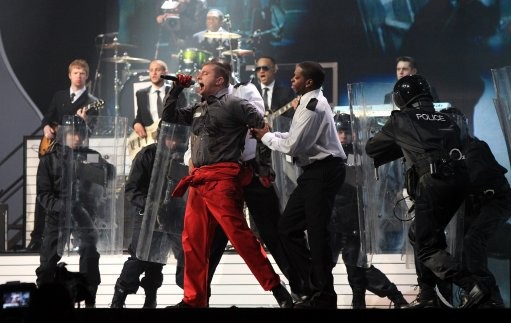 Plan B performs on stage during the 2011 Brit Awards at the O2 Arena, London.