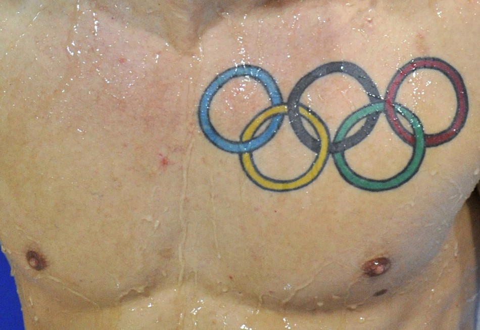 A tattoo of the Olympic rings is seen on Baker of Britain after he dives during the Men039s Synchronised 3m Springboard preliminary round at the FINA Diving World Cup in London
