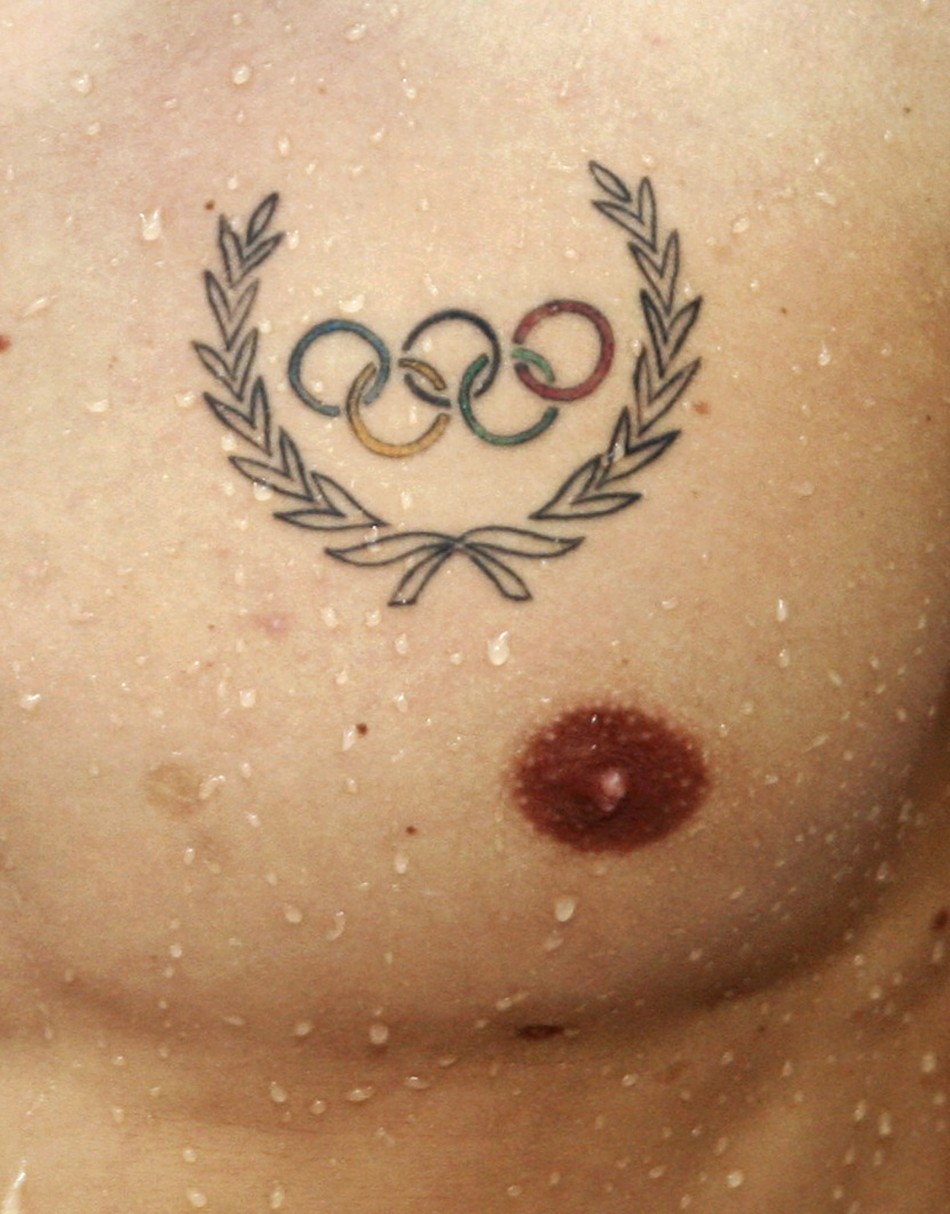 The Olympic logo is tattooed on the chest of a swimmer ahead of the Beijing 2008 Olympic Games
