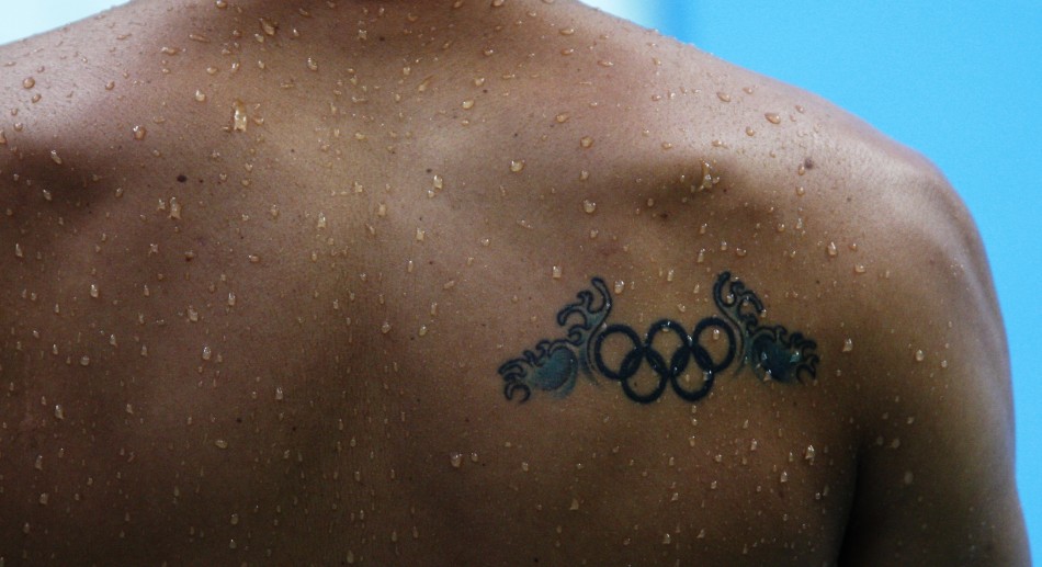 A tattoo is seen on the back of Cassius Duran of Brazil during diving practice ahead of the Beijing 2008 Olympic Games