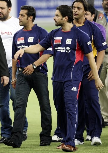 Bollywood actors Salman Khan, right, Sohail Khan, center, and Shoiab Akhtar, left, are seen at the Sportscity ground, before the start of a celebrity cricket match