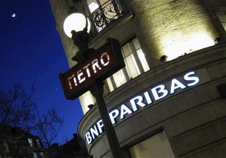 The Paris headquarters of the BNP Paribas bank is seen near a Paris Metro sign