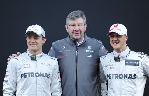 Michael Schumacher of Germany, right, Nico Rosberg of Germany, left, and Mercedes GP F1 team Principal Ross Brawn, pose during new F1 W03 official presentation of Mercedes GP Formula one team 2012 at the Montmelo racetrack near Barcelona, Spain, Tuesday,