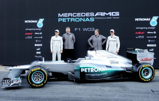 ichael Schumacher of Germany, left, Nico Rosberg of Germany, right, Mercedes GP F1 team Principal Ross Brawn, second left, and Mercedes Motorsport boss Norbert Haugun, second right, take part during new F1 W03 official presentation of Mercedes GP Formula