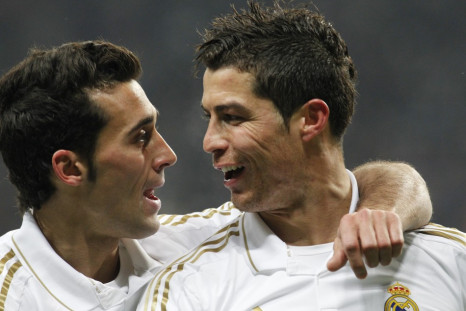 Real Madrid's Ronaldo celebrates after scoring against CSKA Moscow with team mate Arbeloa during their Champions League last 16 first leg soccer match at the Luzhniki stadium in Moscow