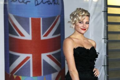British singer Pixie Lott arrives for the BRIT music awards at the O2 Arena in London