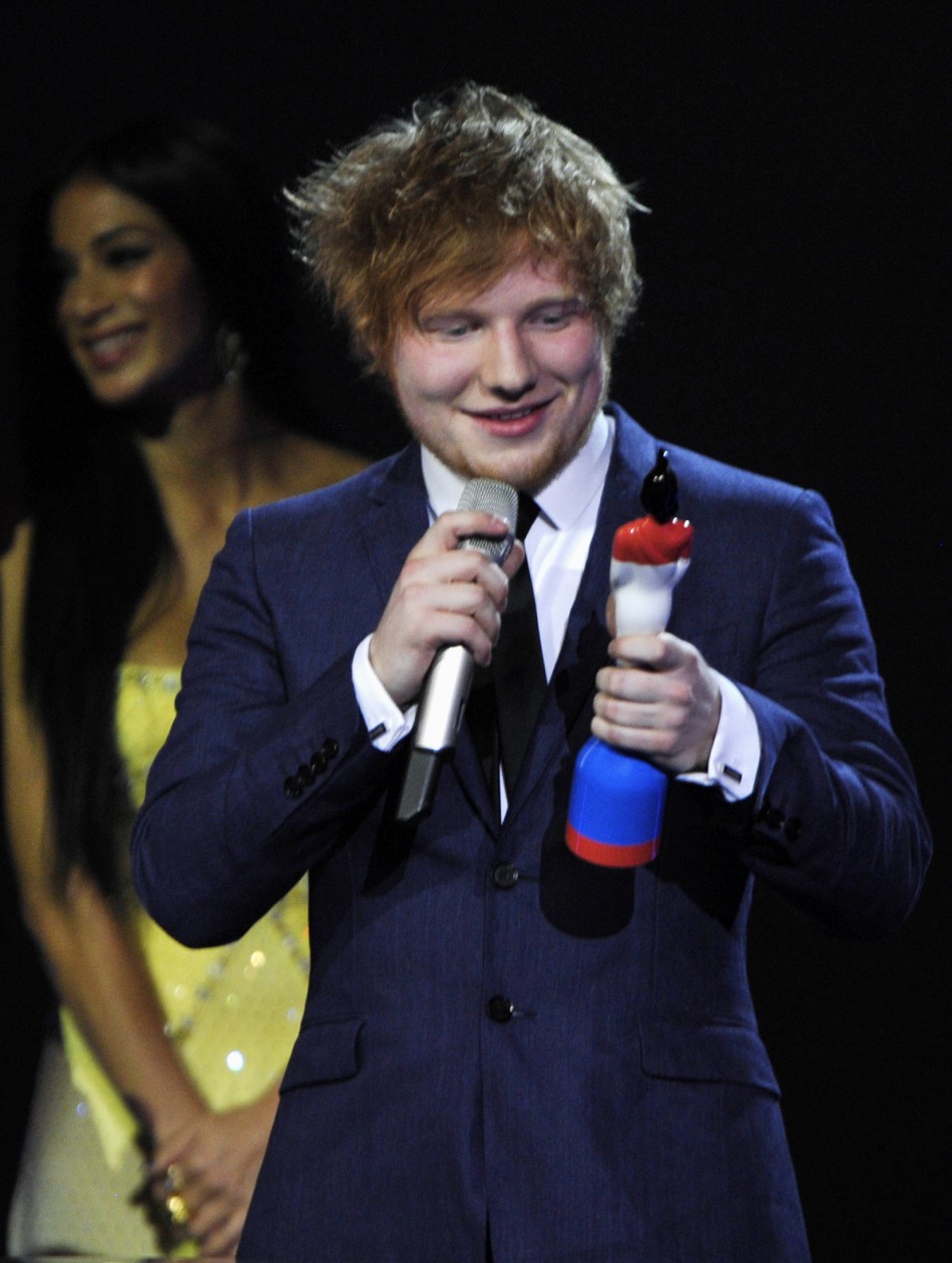 Ed Sheeran holds his best British breakthrough award during the BRIT Music Awards at the O2 Arena in London