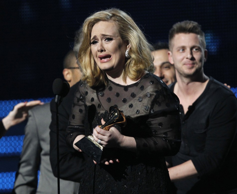 Adele accepts Album of the Year award at the 54th annual Grammy Awards