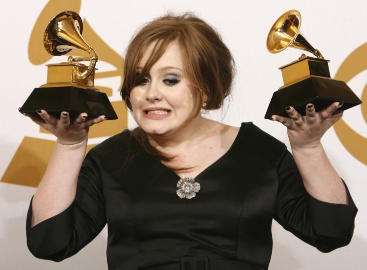 Adele holds her awards for Best New Artist and Best Pop Vocal Album