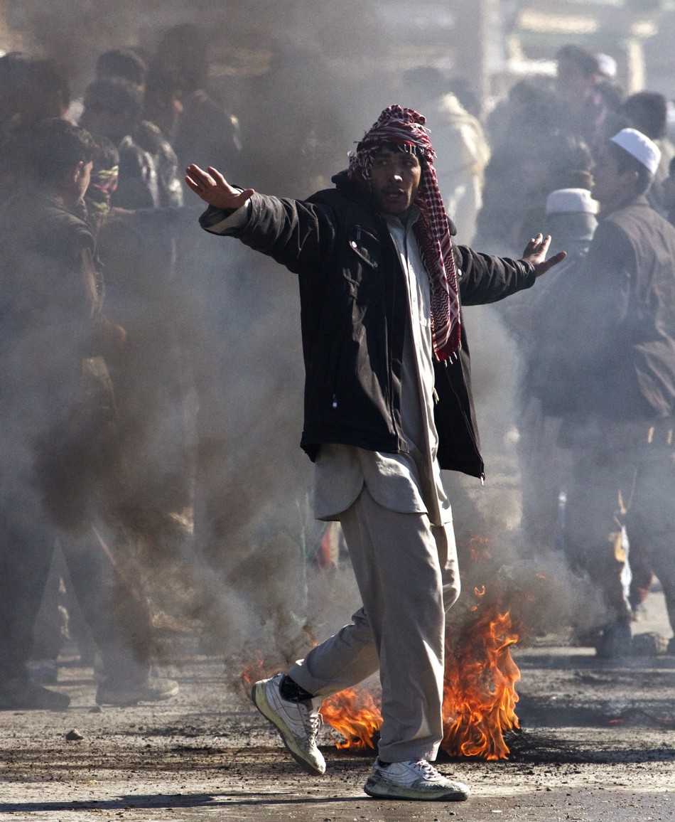 An Afghan protester gestures during a protest near a U.S. military base in Kabul