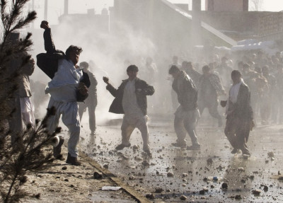 Afghan protesters throw rocks towards a water canon near a U.S. military base in Kabul Afghan protesters throw rocks towards a water canon near a U.S. military base in Kabul