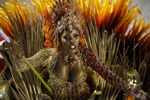 A dancer of Grande Rio samba school parades during carnival celebrations at the Sambadrome in Rio de Janeiro, Brazil, Tuesday, Feb. 21, 2012. Nearly 100,000 paying spectators turn out for the all-night spectacle at the Sambadrome
