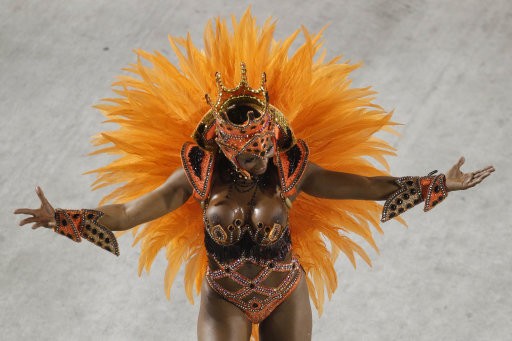 EDS NOTE NUDITY - A dancer from Salgueiro samba school parades during carnival celebrations at the Sambadrome in Rio de Janeiro, Brazil, Tuesday Feb. 21, 2012.