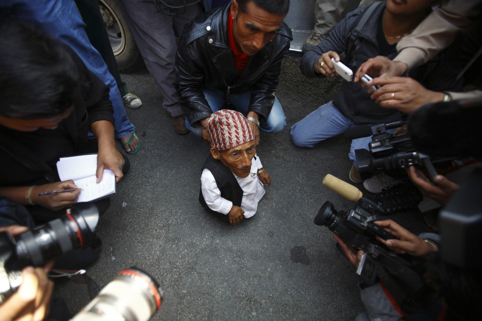 Dangi, 72, who claims to be the world039s shortest man standing at a height of 22 inches, speaks to the media at Tribhuvan International Airport upon his arrival in Kathmandu