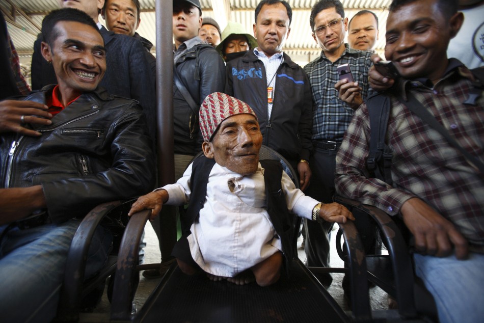 Dangi, 72, who claims to be the world039s shortest man standing at a height of 22 inches, speaks to the media at Tribhuvan International Airport upon his arrival, in Kathmandu
