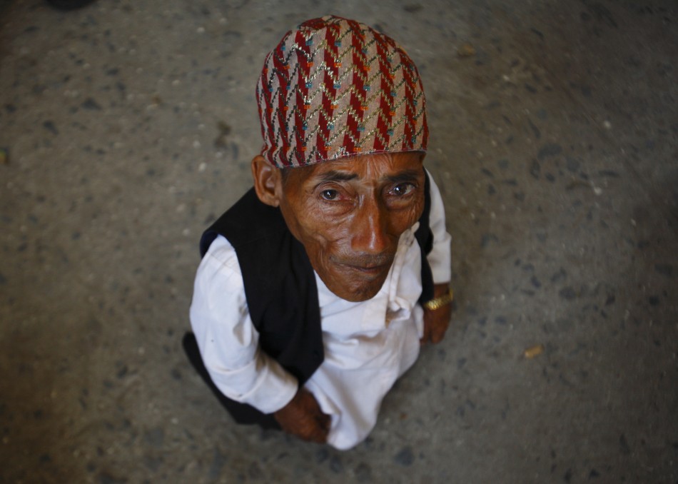 Dangi, 72, who claims to be the world039s shortest man standing at a height of 22 inches, is pictured at Tribhuvan International Airport upon his arrival in Kathmandu