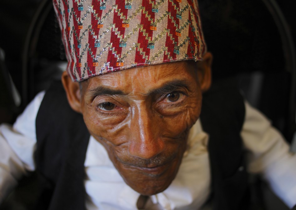 Dangi, 72, who claims to be the world039s shortest man standing at a height of 22 inches, is pictured at Tribhuvan International Airport upon his arrival in Kathmandu