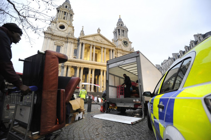 Occupy supporters begin to dismantle encampment from outside St Paul's Cathedral after losing appeal against eviction
