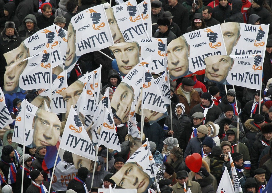 People rally in support of Russian Prime Minister Vladimir Putins bid for re-election at Luzhniki stadium on Defender of Fatherland Day in Moscow
