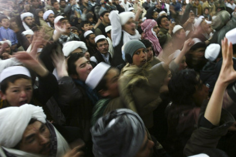 Afghan protesters shout anti-U.S. slogans during a protest against the burning of Korans by US troops